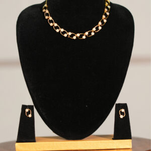 Elegant Star Link Gold Necklace Set on Jewellery Bust