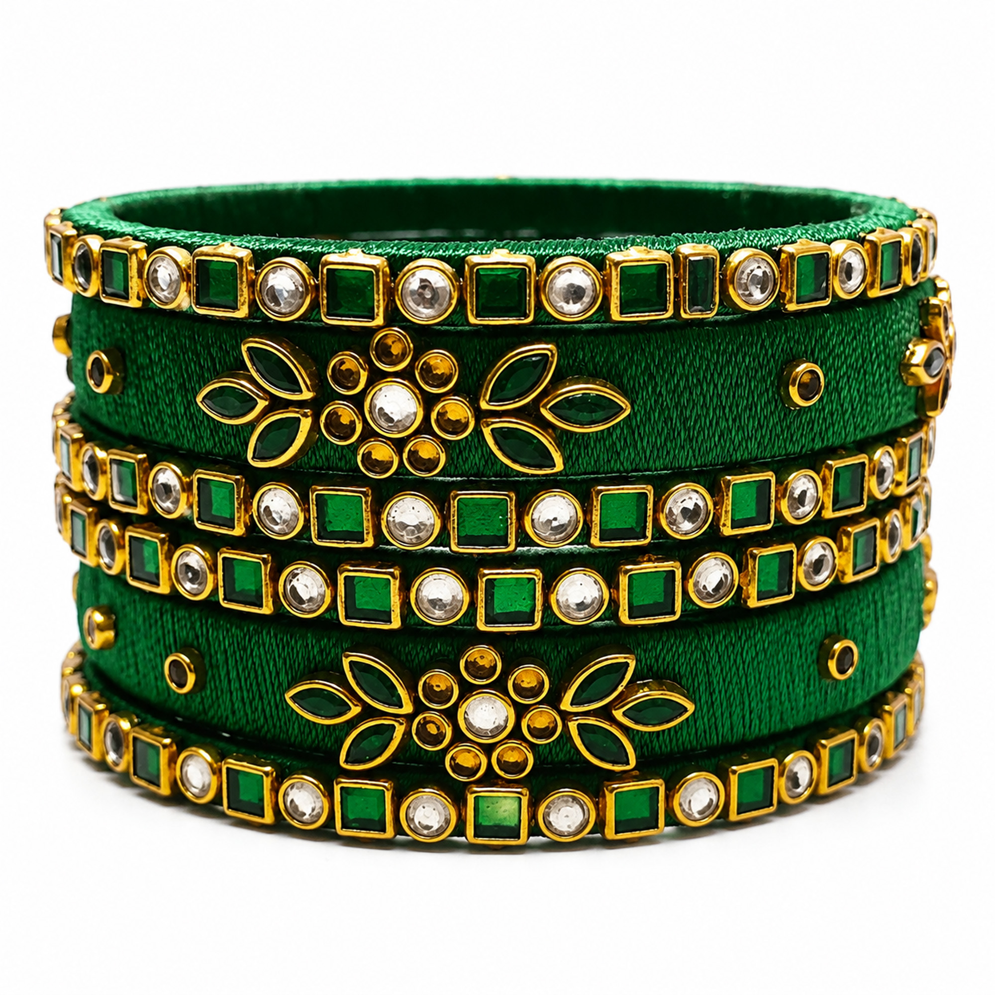 Emerald green and gold silk thread bangles with floral detailing on white background