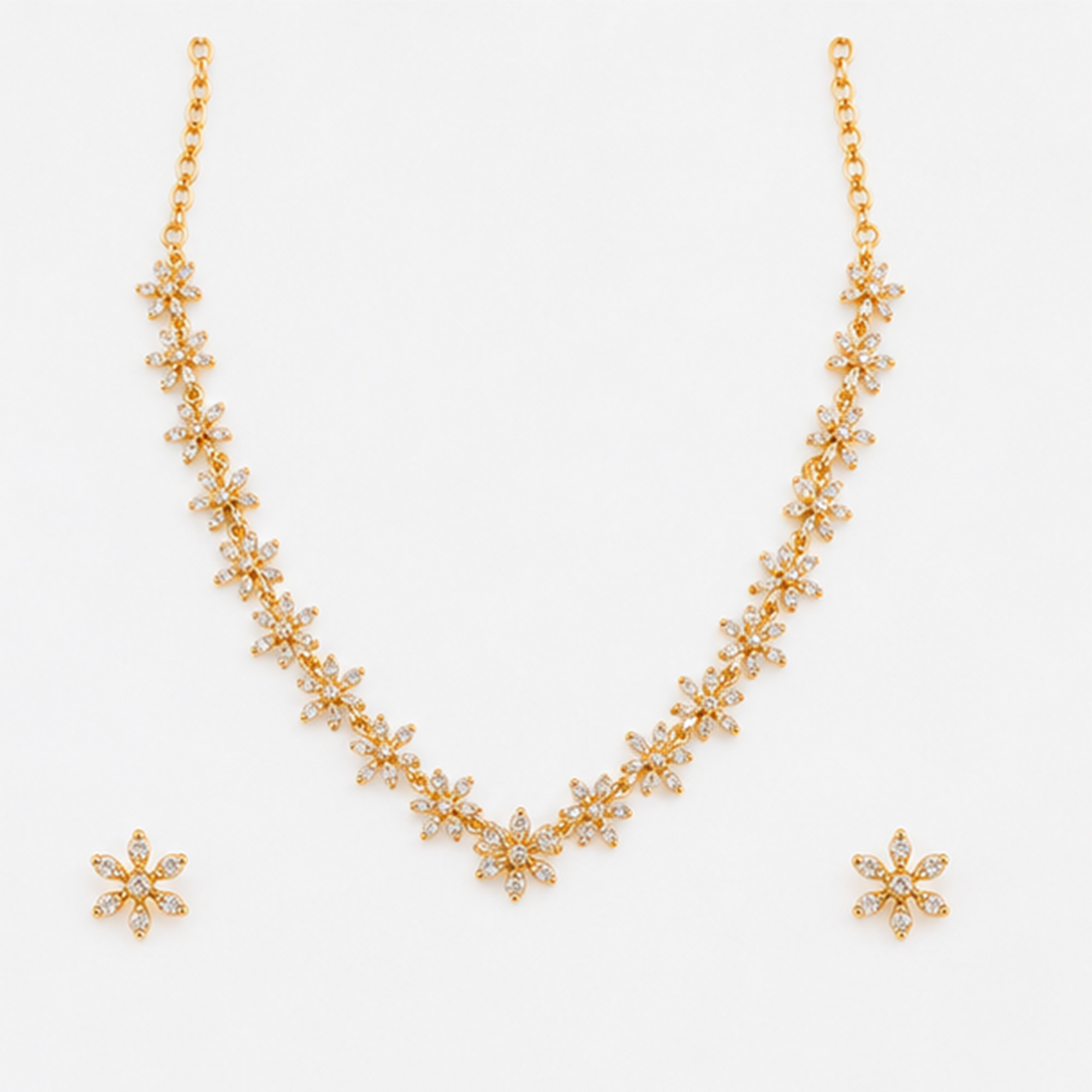 Golden Floral Charm Necklace Set on White Background