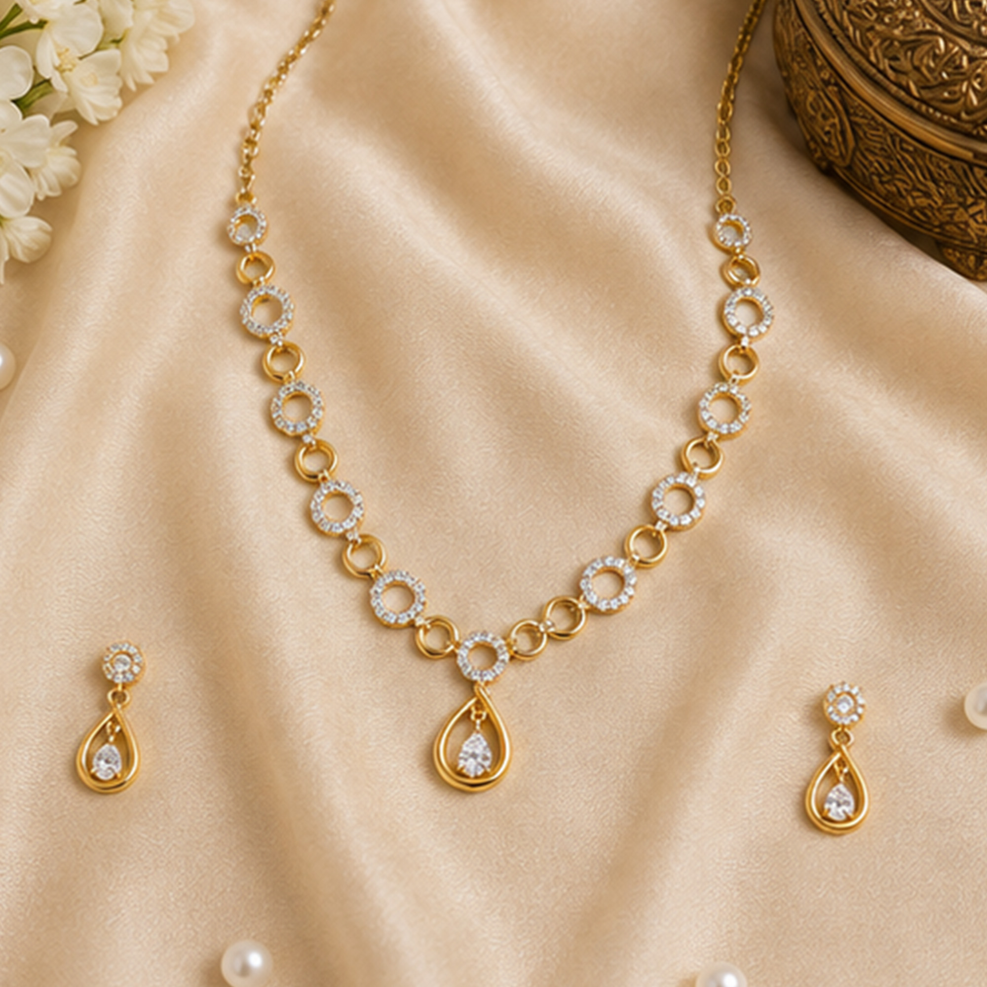 Regal Teardrop Necklace Set on Silk Background