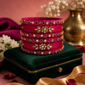 Royal pink floral silk thread bangles in an elegant lifestyle setting