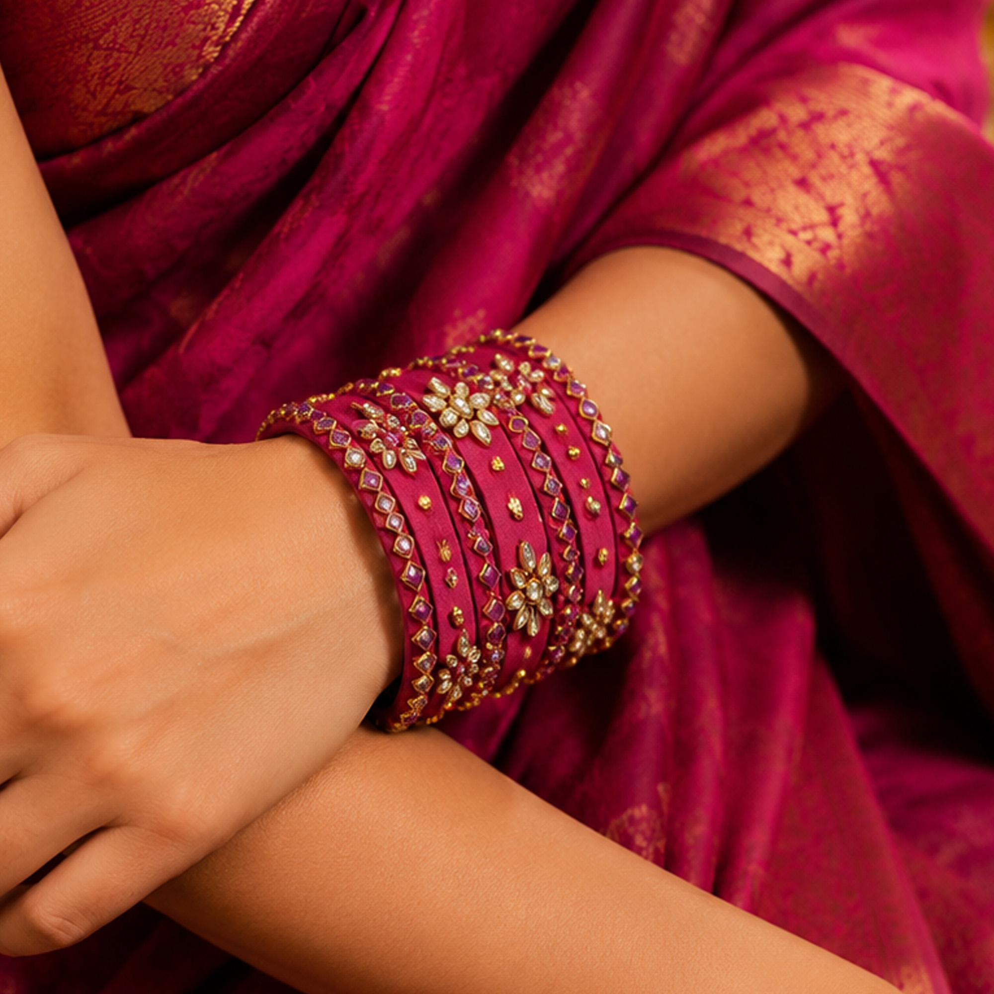 Royal pink floral silk thread bangles worn by a woman