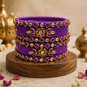 Royal purple floral silk thread bangles in a premium product setting