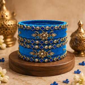 Sky blue and gold floral silk thread bangles in a premium setting